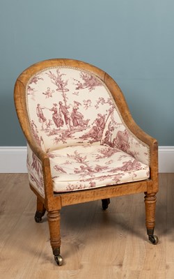 Lot 378 - A William IV birds eye maple tub form armchair in the Gillows manner