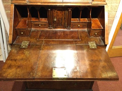 Lot 82 - An 18th century walnut bureau bookcase of...