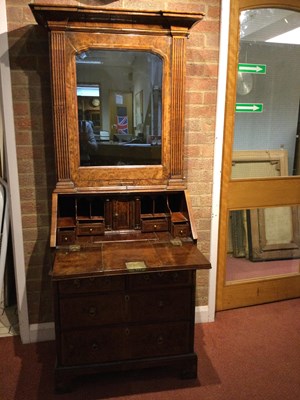Lot 82 - An 18th century walnut bureau bookcase of...