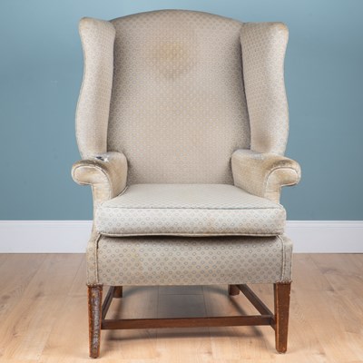Lot 1111 - A Georgian mahogany-framed wingback armchair