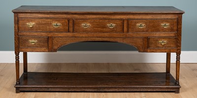 Lot 1177 - An antique oak dresser