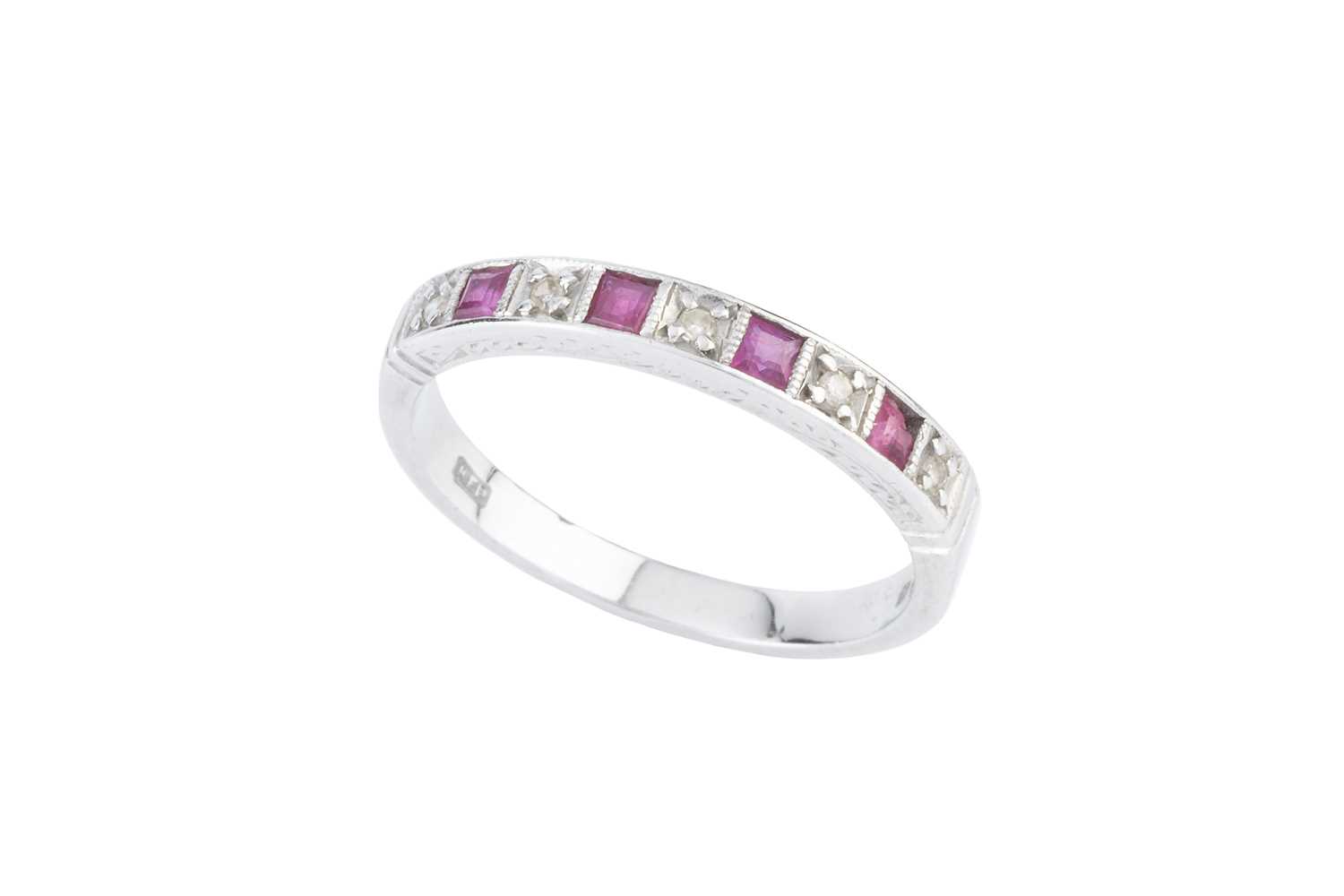 Lot 134 - A diamond and ruby half hoop ring, alternately...