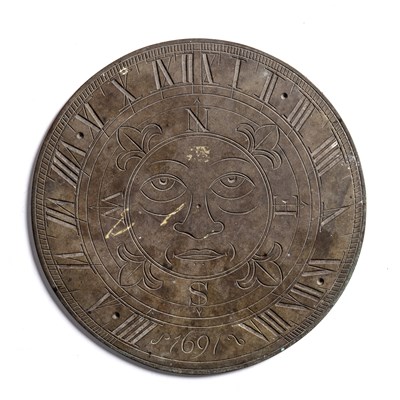Lot 416 - Bronze sundial engraved with a green man to...