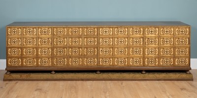 Lot 411 - A large sideboard on a plinth base