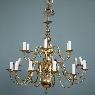 Lot 86 - A brass eighteen-branch chandelier