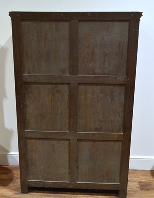Lot 65 - Limed oak linen fold cupboard with iron hinges...