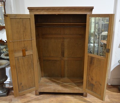 Lot 65 - Limed oak linen fold cupboard with iron hinges...