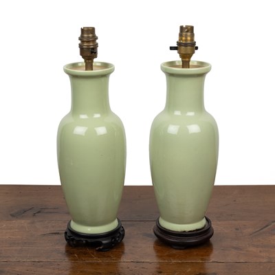 Lot 432 - A pair of green-glazed table lamps in the Oriental style