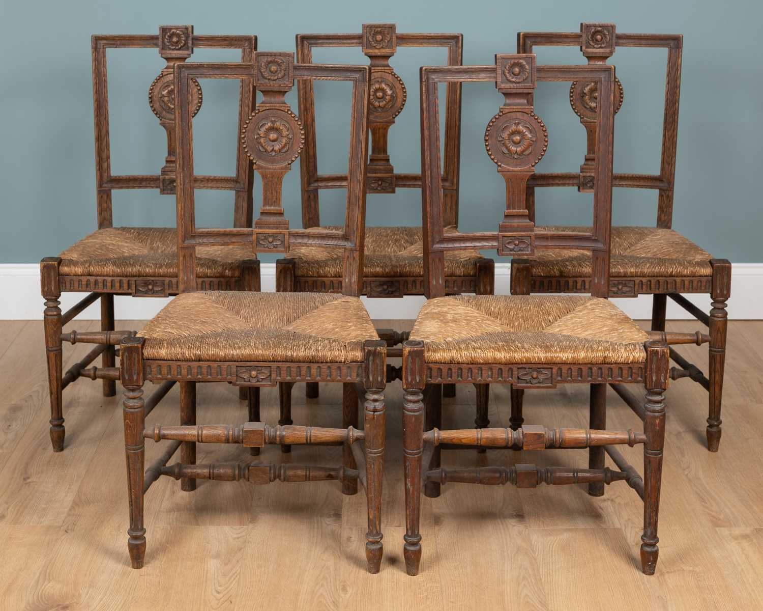Lot 1110 - A set of five antique French country-made oak kitchen chairs
