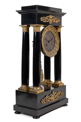 Lot 260 - A 19th century French Empire Portico mantel clock