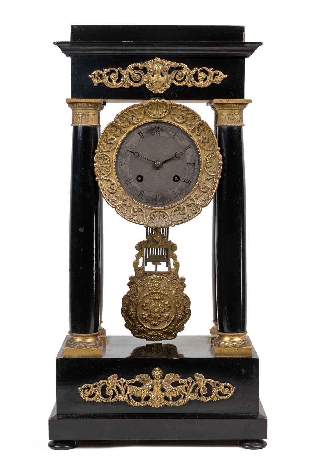 Lot 260 - A 19th century French Empire Portico mantel clock