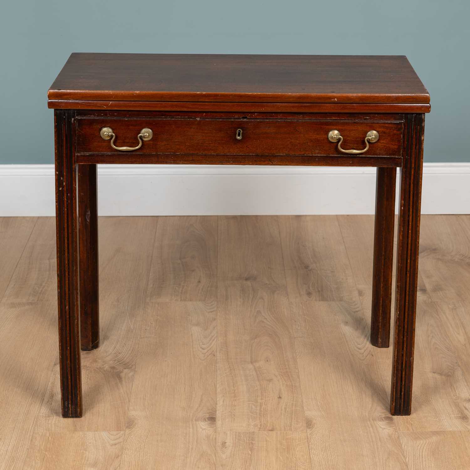 Lot 261 - A George III mahogany Chippendale-style fold-over card table