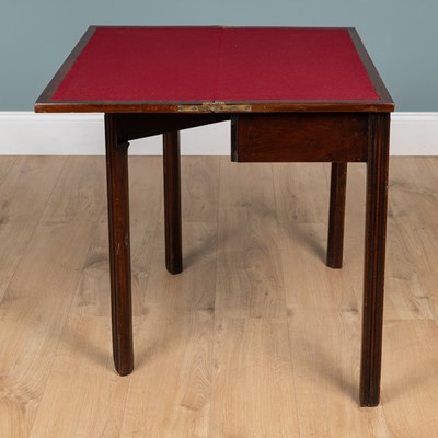 Lot 261 - A George III mahogany Chippendale-style fold-over card table