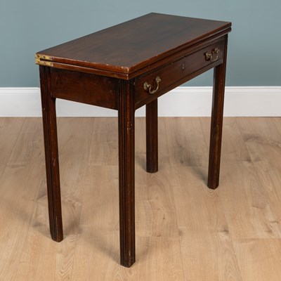 Lot 261 - A George III mahogany Chippendale-style fold-over card table