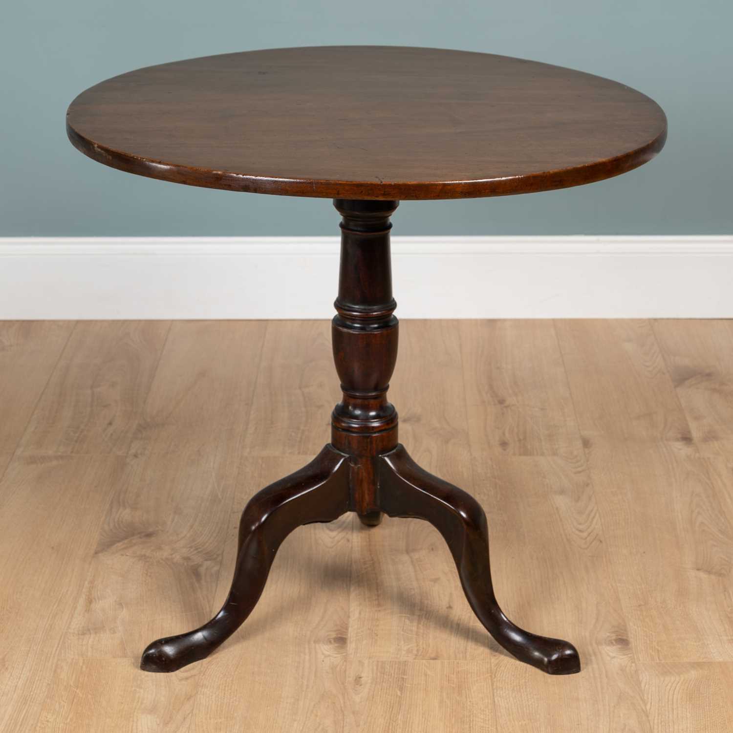Lot 393 - A George III mahogany circular tilt-top tripod table