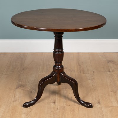 Lot 393 - A George III mahogany circular tilt-top tripod table