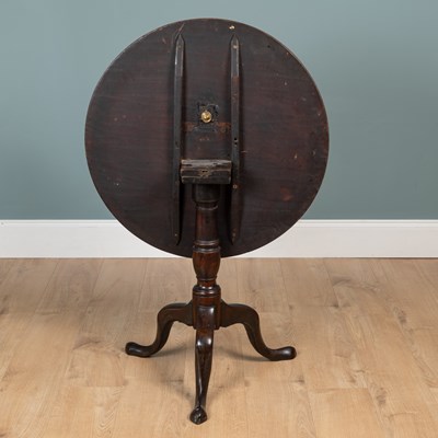 Lot 393 - A George III mahogany circular tilt-top tripod table