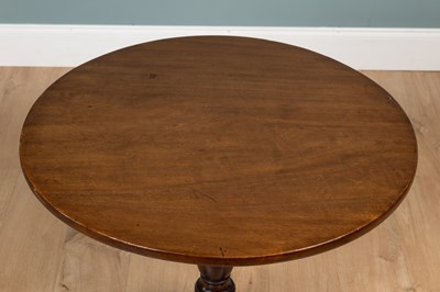 Lot 393 - A George III mahogany circular tilt-top tripod table