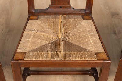 Lot 1302 - A group of three George II walnut dining chairs