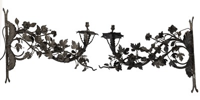 Lot 1468 - A pair of antique wrought iron lamp brackets