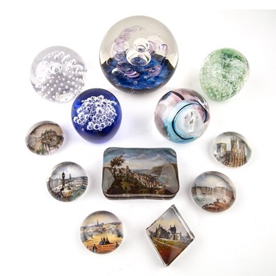 Lot 282 - A collection of glass paperweights to include:...