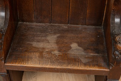 Lot 1217 - An oak choir stall and an oak chair