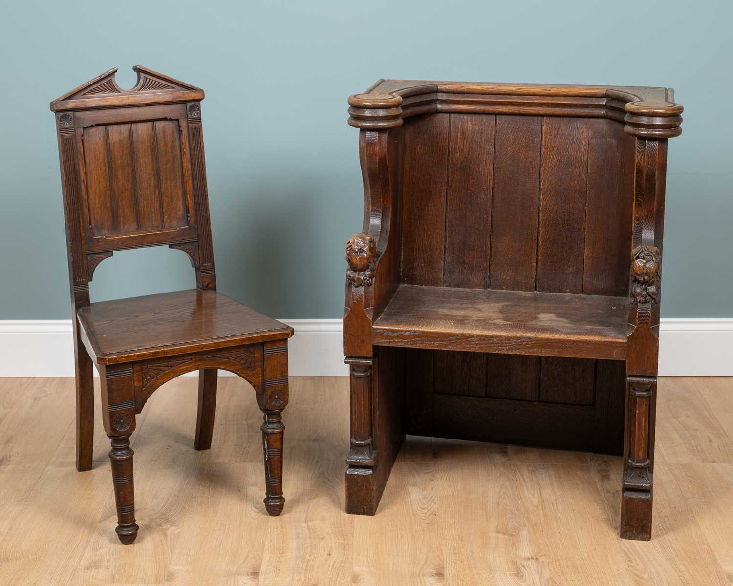 Lot 1217 - An oak choir stall and an oak chair