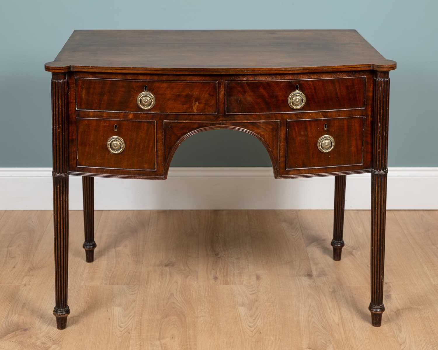 Lot 388 - A George III mahogany bow-front side table