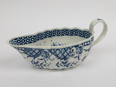 Lot 1335 - A group of four 18th century blue and white porcelain gravy boats