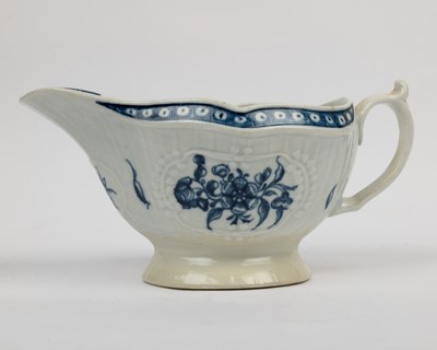 Lot 1335 - A group of four 18th century blue and white porcelain gravy boats
