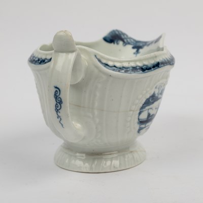 Lot 1335 - A group of four 18th century blue and white porcelain gravy boats