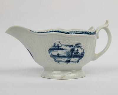 Lot 1335 - A group of four 18th century blue and white porcelain gravy boats