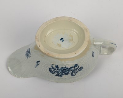 Lot 1335 - A group of four 18th century blue and white porcelain gravy boats