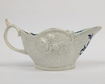 Lot 1335 - A group of four 18th century blue and white porcelain gravy boats