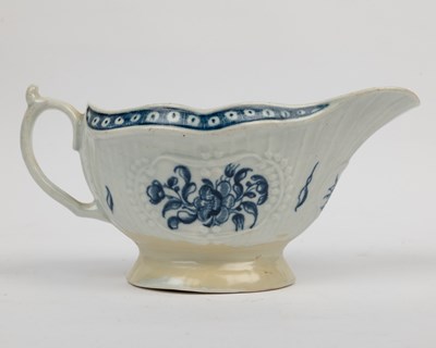 Lot 1335 - A group of four 18th century blue and white porcelain gravy boats