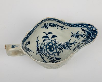 Lot 1335 - A group of four 18th century blue and white porcelain gravy boats