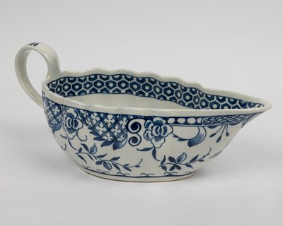 Lot 1335 - A group of four 18th century blue and white porcelain gravy boats