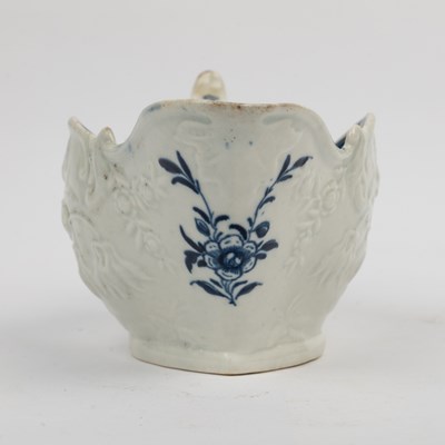 Lot 1335 - A group of four 18th century blue and white porcelain gravy boats