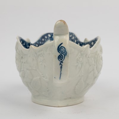 Lot 1335 - A group of four 18th century blue and white porcelain gravy boats
