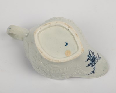 Lot 1335 - A group of four 18th century blue and white porcelain gravy boats