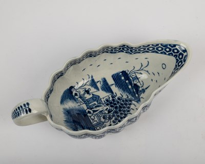 Lot 1335 - A group of four 18th century blue and white porcelain gravy boats