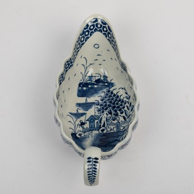 Lot 1335 - A group of four 18th century blue and white porcelain gravy boats