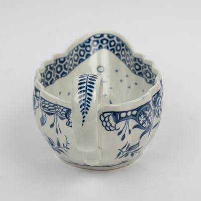Lot 1335 - A group of four 18th century blue and white porcelain gravy boats