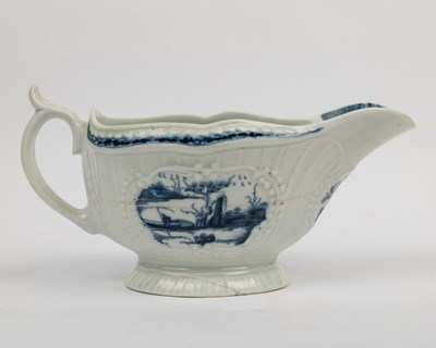 Lot 1335 - A group of four 18th century blue and white porcelain gravy boats