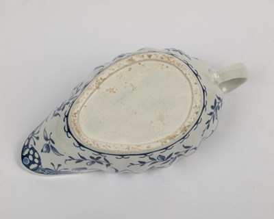 Lot 1335 - A group of four 18th century blue and white porcelain gravy boats