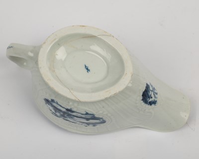 Lot 1335 - A group of four 18th century blue and white porcelain gravy boats