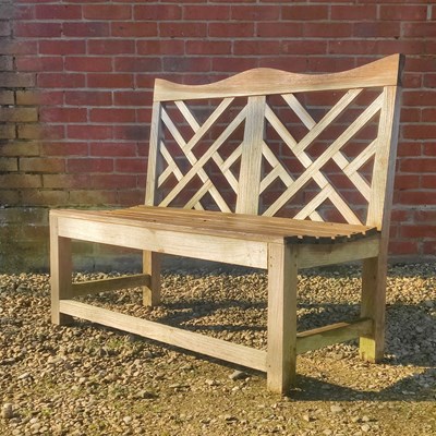 Lot 1514 - A teak garden bench by Charles Verey