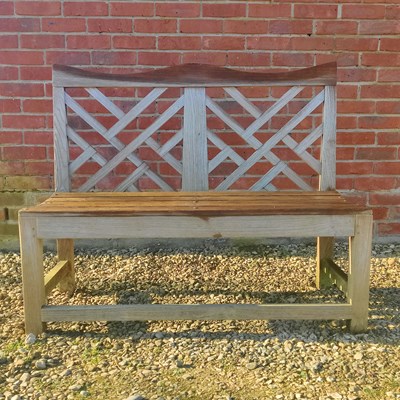 Lot 1514 - A teak garden bench by Charles Verey