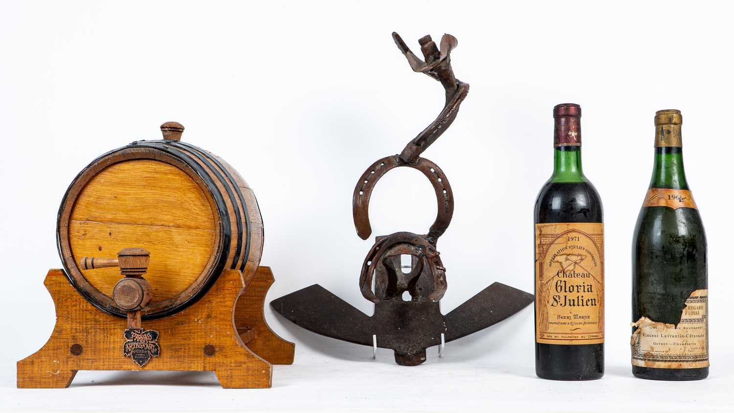 Lot 1417 - Two bottles of wine and a wine bottle stand