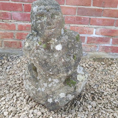Lot 1508 - A carved granite gnome or squat figure